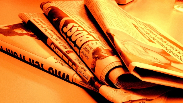 Newspaper fire orange by Jon S