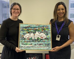 Keryn Hyslop (left) presenting Director of Womens Legal Centre Community Services, Adelaide with her art
